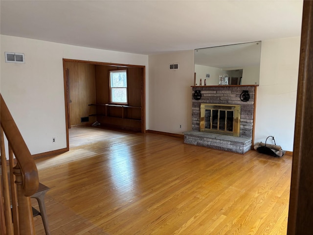 unfurnished living room featuring light hardwood / wood-style floors