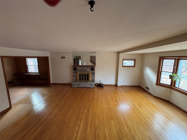 unfurnished living room with light hardwood / wood-style floors