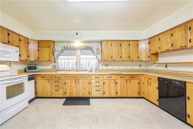 kitchen with sink and white appliances