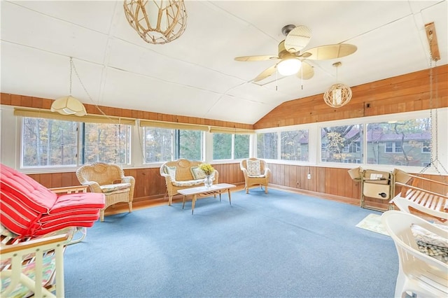 sunroom with ceiling fan and lofted ceiling