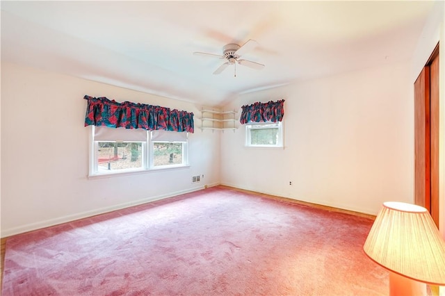 unfurnished room featuring ceiling fan, carpet floors, and lofted ceiling