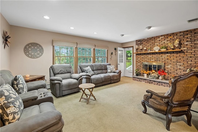 carpeted living room featuring baseboard heating and a fireplace