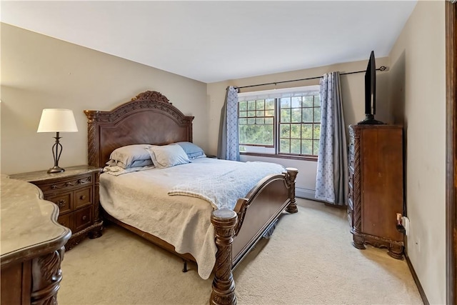 bedroom featuring light colored carpet