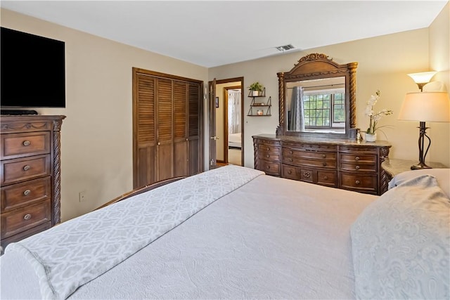 bedroom with carpet flooring and a closet