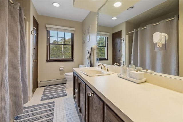 bathroom with baseboard heating, tile patterned flooring, vanity, and toilet