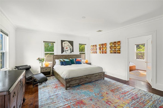 bedroom with hardwood / wood-style flooring and ornamental molding