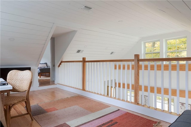 interior space featuring hardwood / wood-style flooring and lofted ceiling