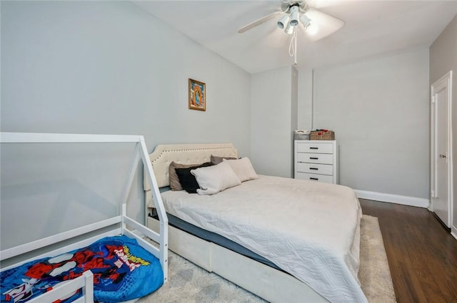 bedroom with hardwood / wood-style floors and ceiling fan