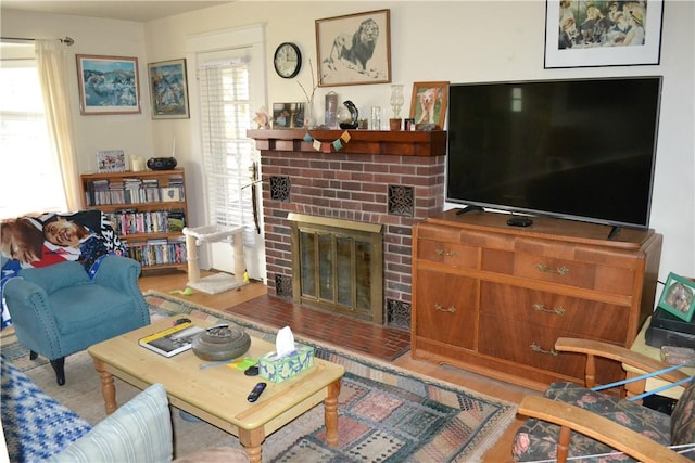 living room featuring a fireplace and light wood-type flooring