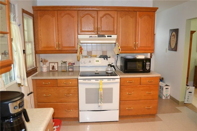 kitchen featuring white range with electric cooktop and decorative backsplash