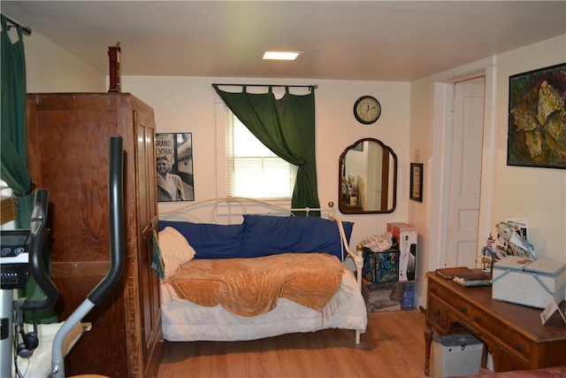 bedroom with wood-type flooring