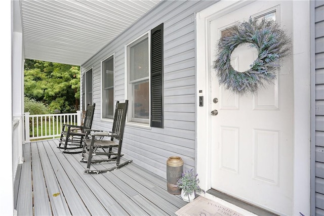 property entrance with covered porch