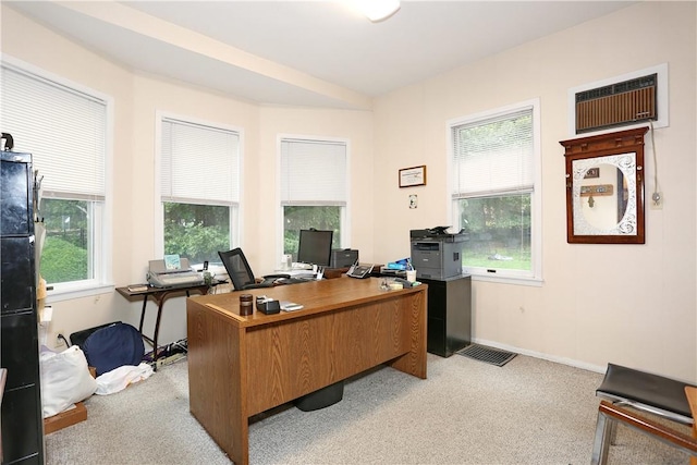 carpeted office space with a wealth of natural light and a wall mounted AC