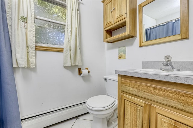 bathroom featuring baseboard heating, tile patterned floors, vanity, and toilet