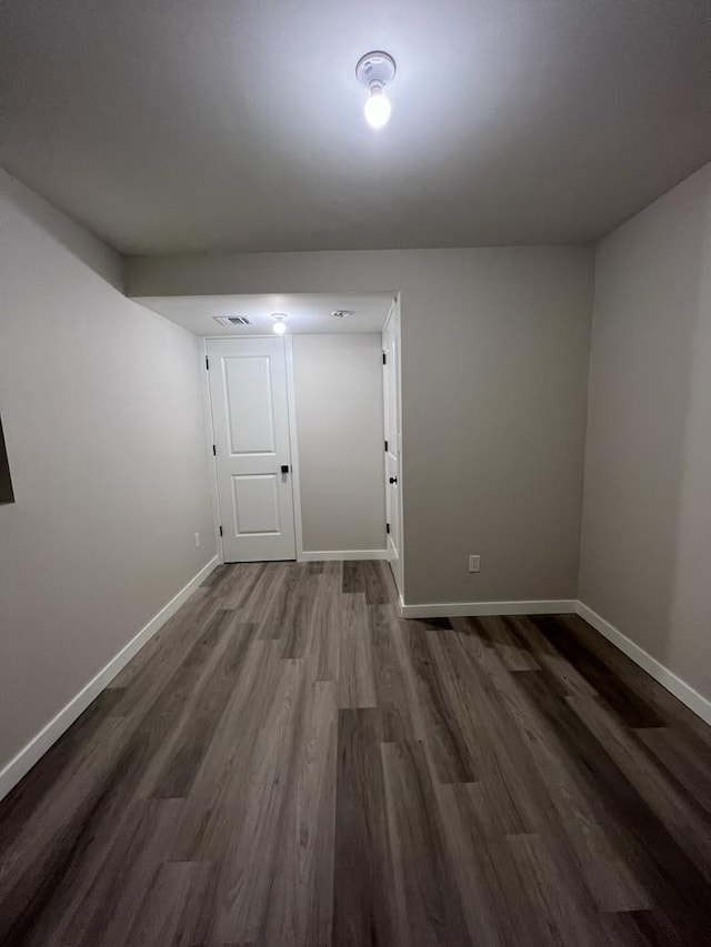 empty room featuring dark hardwood / wood-style floors