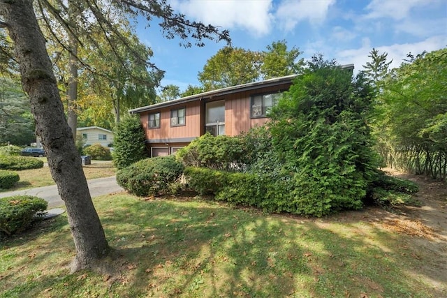 view of front of home with a front yard