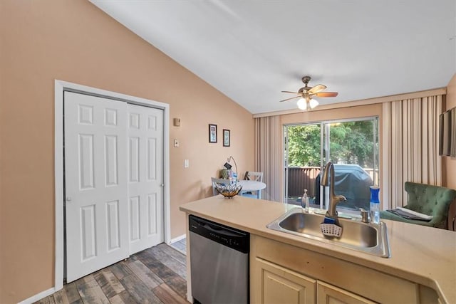 kitchen with ceiling fan, dishwasher, sink, dark wood-type flooring, and lofted ceiling