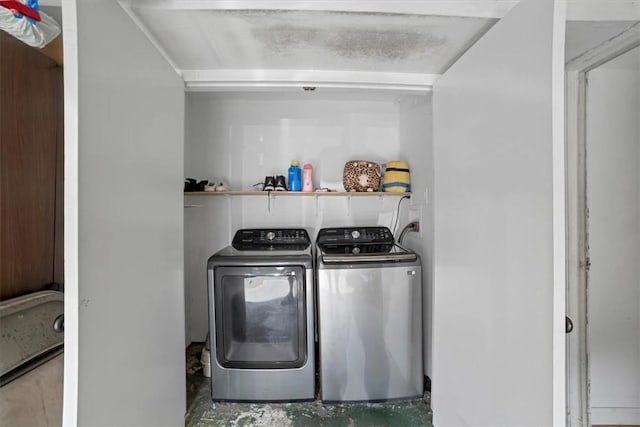 laundry room featuring washing machine and clothes dryer