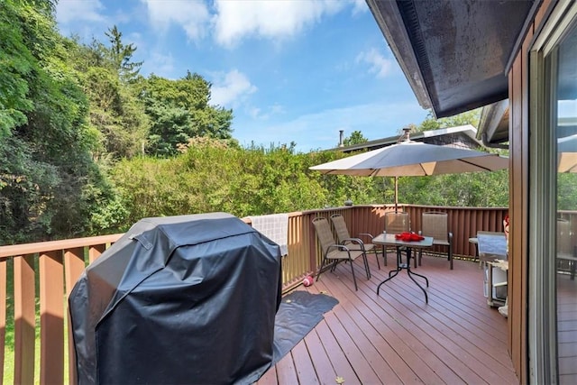 wooden terrace featuring area for grilling