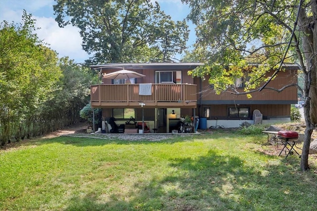 back of house featuring a yard and a deck