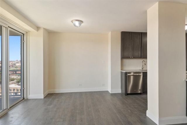 interior space featuring dark hardwood / wood-style flooring, sink, and a wealth of natural light