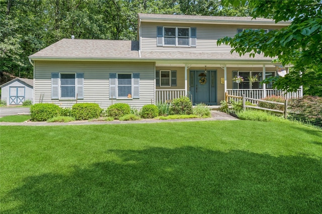 210 Bulsontown Rd, Stony Point, NY 10980 - traditional-style home with a storage unit, a front lawn, covered porch, and roof with shingles