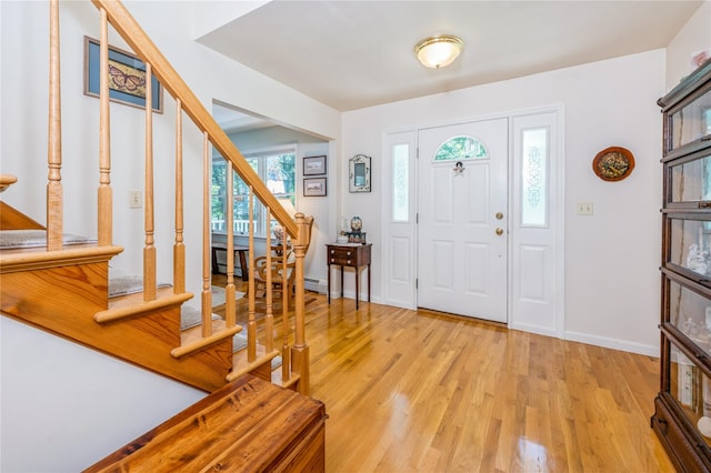 210 Bulsontown Rd, Stony Point, NY 10980 - foyer entrance featuring stairs, light wood-style flooring, and a baseboard heating unit