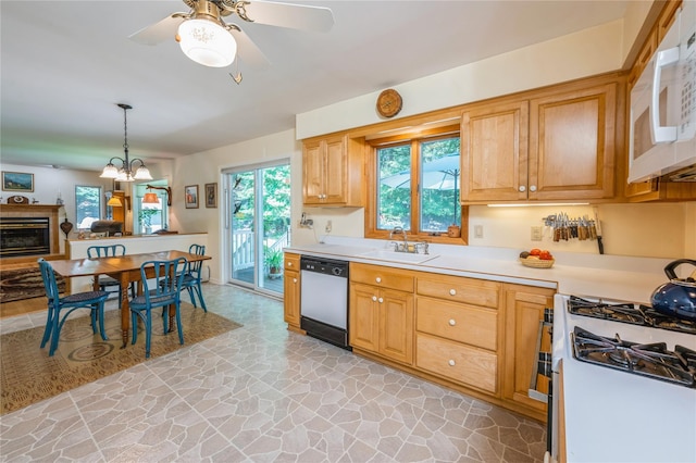 210 Bulsontown Rd, Stony Point, NY 10980 - kitchen with white appliances, light countertops, stone flooring, a ceiling fan, and a chandelier