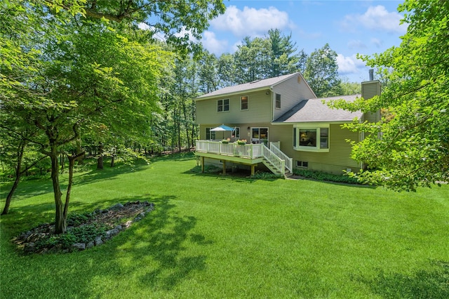 210 Bulsontown Rd, Stony Point, NY 10980 - back of property with a chimney, a deck, stairway, a yard, and a shingled roof