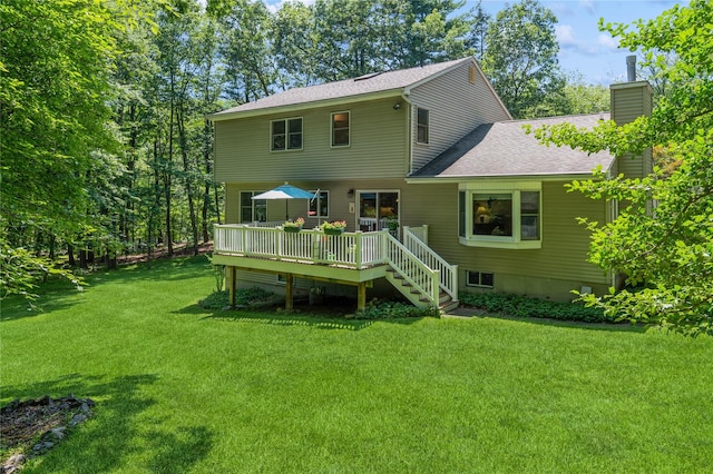 210 Bulsontown Rd, Stony Point, NY 10980 - rear view of property with a chimney, a deck, a lawn, and roof with shingles