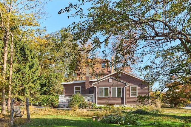 view of side of home featuring a lawn