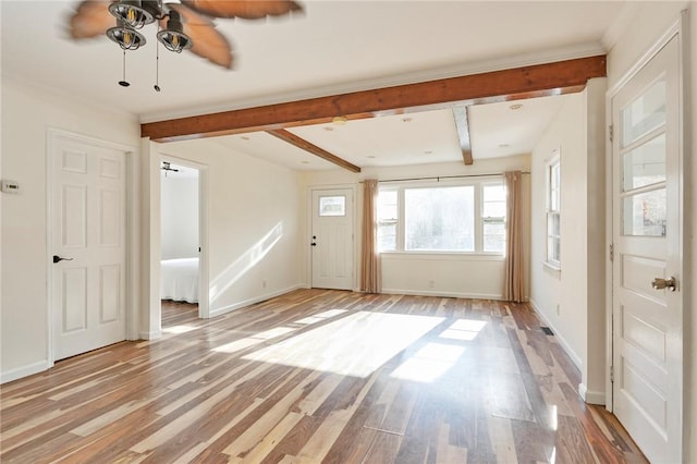 interior space featuring beam ceiling, light hardwood / wood-style flooring, and ceiling fan