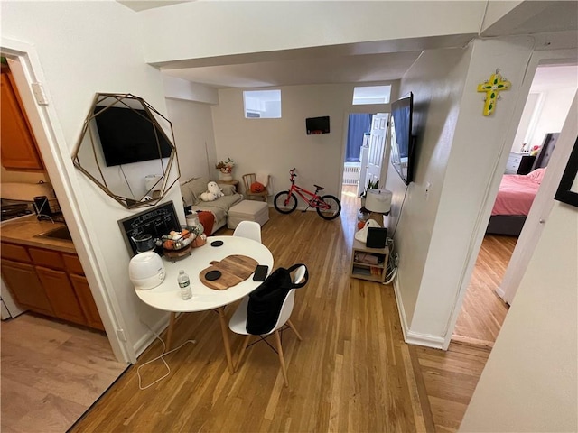 dining space featuring light wood-type flooring