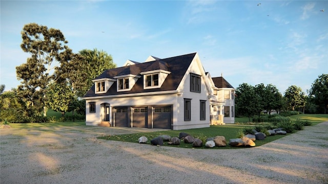 view of side of property with a yard and a garage