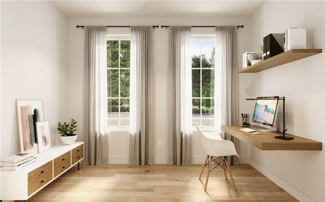 interior space featuring light wood-type flooring and a wealth of natural light