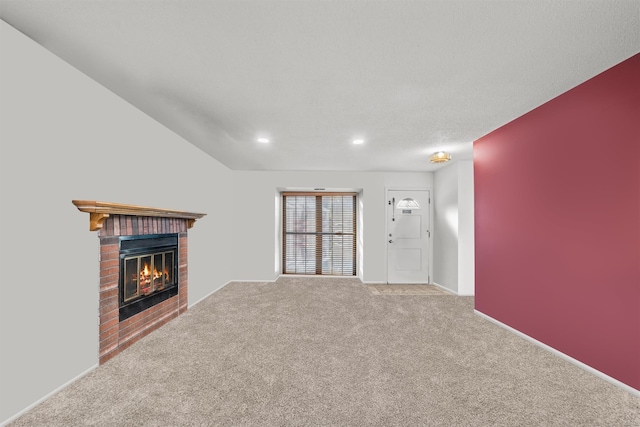 unfurnished living room featuring a fireplace and carpet flooring