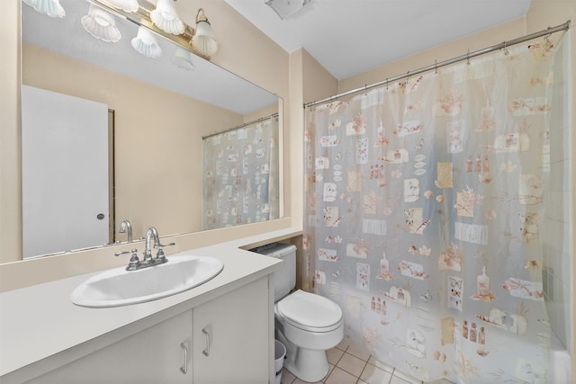 bathroom featuring tile patterned flooring, vanity, and toilet