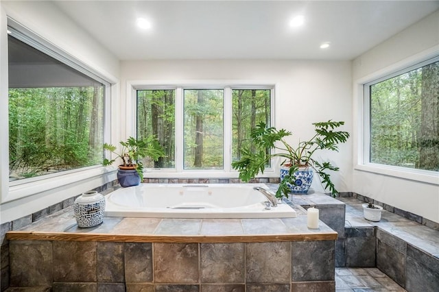 bathroom with tiled tub