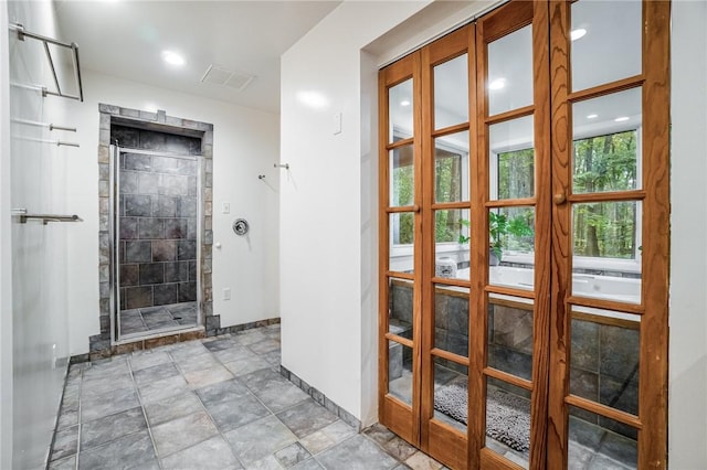 interior space with a shower with shower door