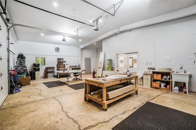 garage featuring a workshop area and a garage door opener