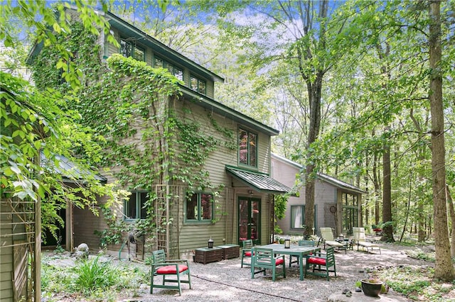 rear view of house featuring french doors and a patio