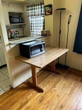 dining space featuring light wood-type flooring