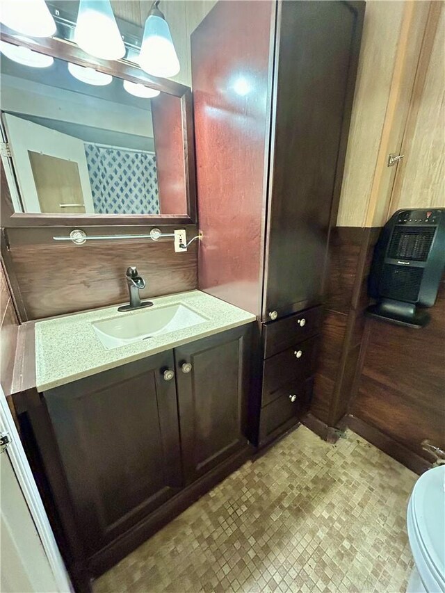 bathroom featuring vanity and toilet