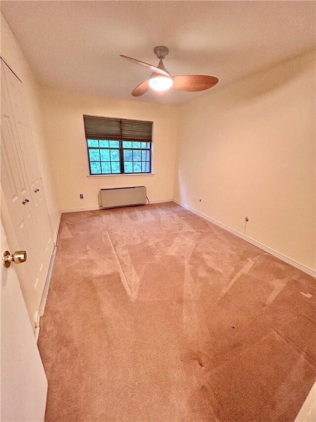 empty room featuring carpet, a textured ceiling, and ceiling fan