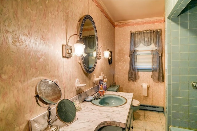 bathroom with vanity, a baseboard heating unit, crown molding, tile patterned flooring, and toilet