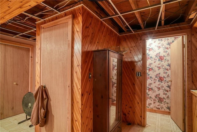 miscellaneous room featuring wooden walls