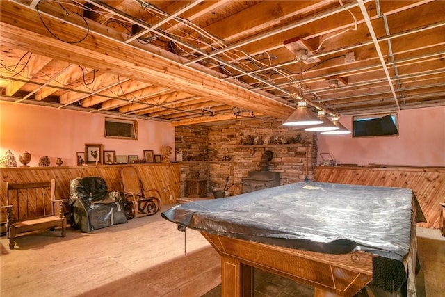 playroom featuring a wood stove and pool table