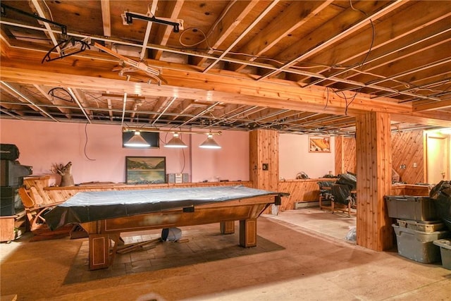 recreation room featuring wood walls, a baseboard heating unit, billiards, and concrete floors