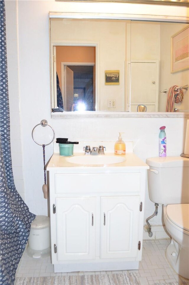 bathroom with vanity and toilet