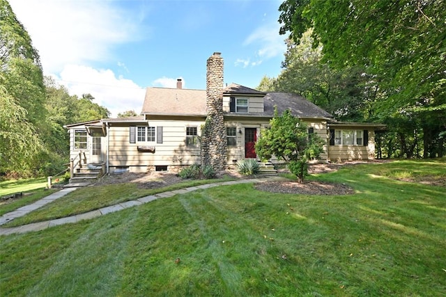 back of house featuring a lawn